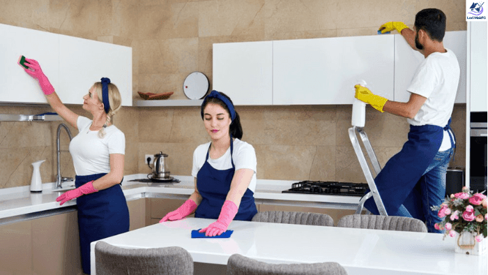house cleaners cleaning cabinets and counter