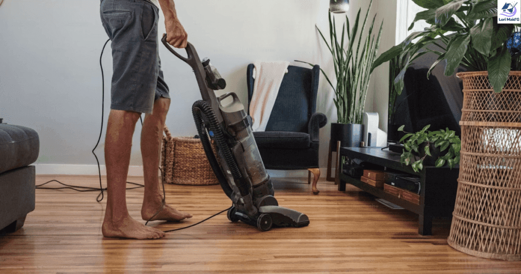 a person cleaning old hardwood floor