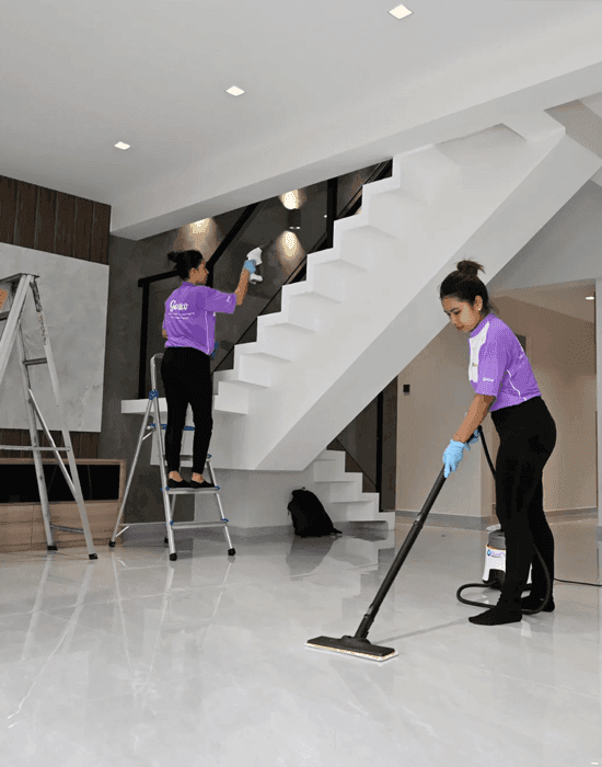Professional house cleaners cleaning a house.